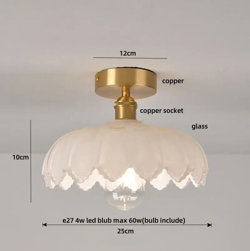 Delicate white glass flush mounted ceiling light with scalloped edge and brass copper fittings for bedroom use