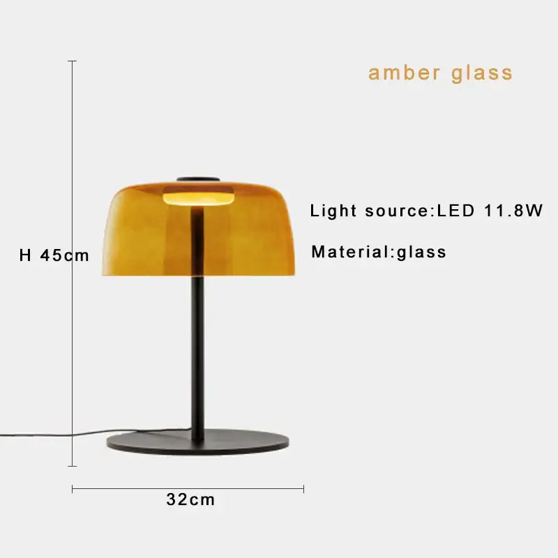 Modern green glass table lamp for bedroom with amber glass shade and sleek black metal base with led bulb