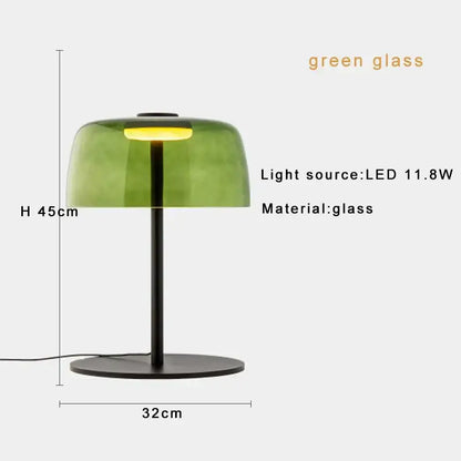 Modern green glass table lamp with translucent dome and black metal base ideal for bedroom use with led bulb