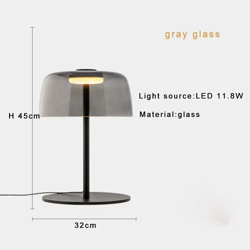 Modern table lamp with sleek translucent gray glass dome and black metal base for bedroom use with led bulb