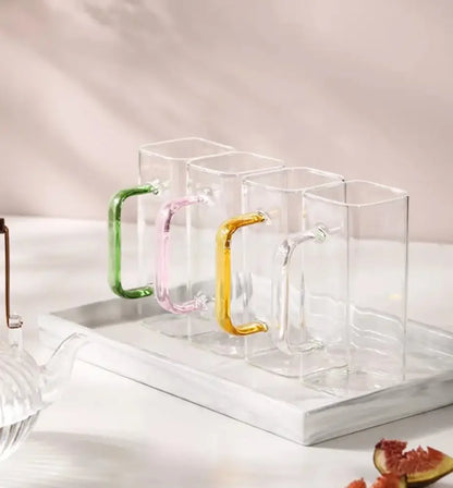 Modern green handle square glass mug with colorful handles in green pink and yellow for kitchen drinking use