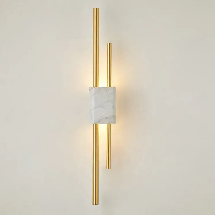 Modern gold-toned wall lamp with white marble accent and vertical rods for decorbites light luxury living room decor