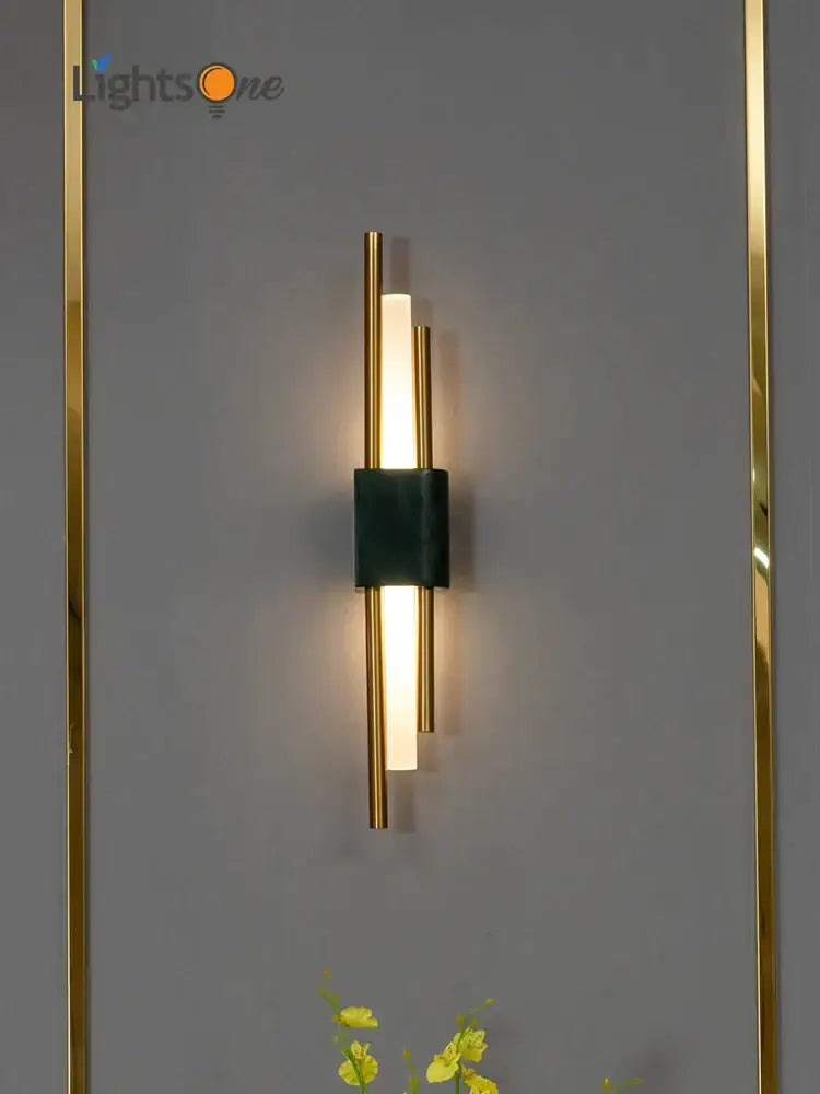 Modern green marble and gold light luxury wall lamp with sleek gold-toned rods and illuminated central bar decorbites light luxury