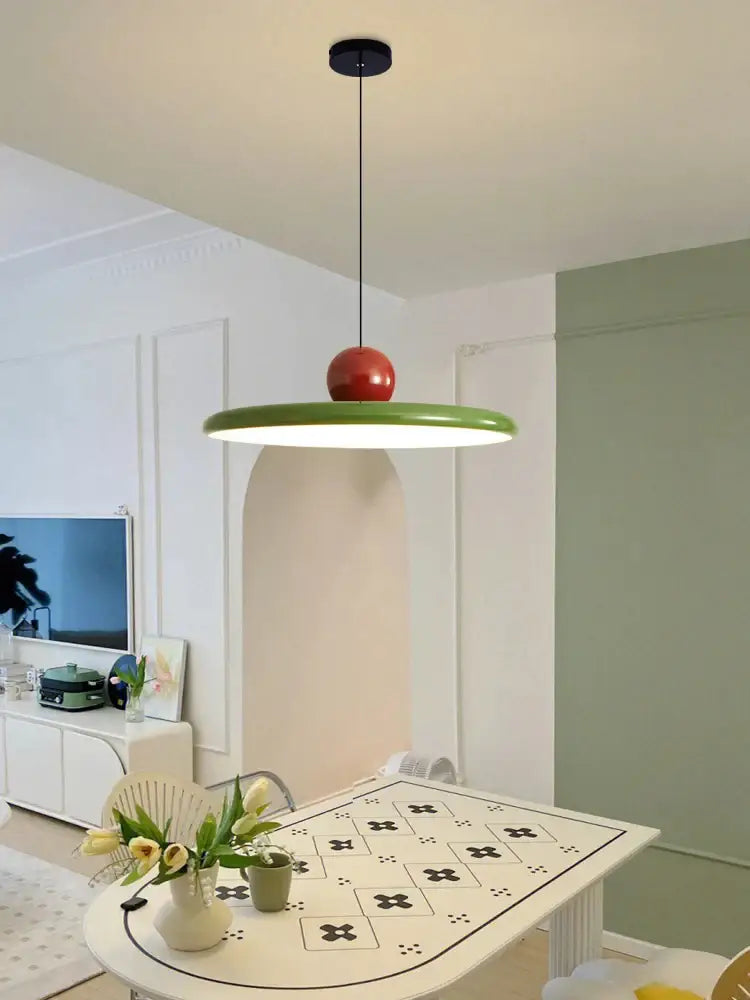 Modern green and red colorful metal led pendant light with a sleek circular shade for kitchen pendant lights decorbites colorful metal