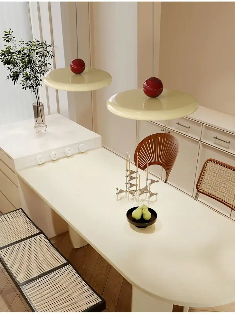 Cream-colored pendant light with glossy red spherical accents featuring led bulbs and a graceful silhouette for dining room