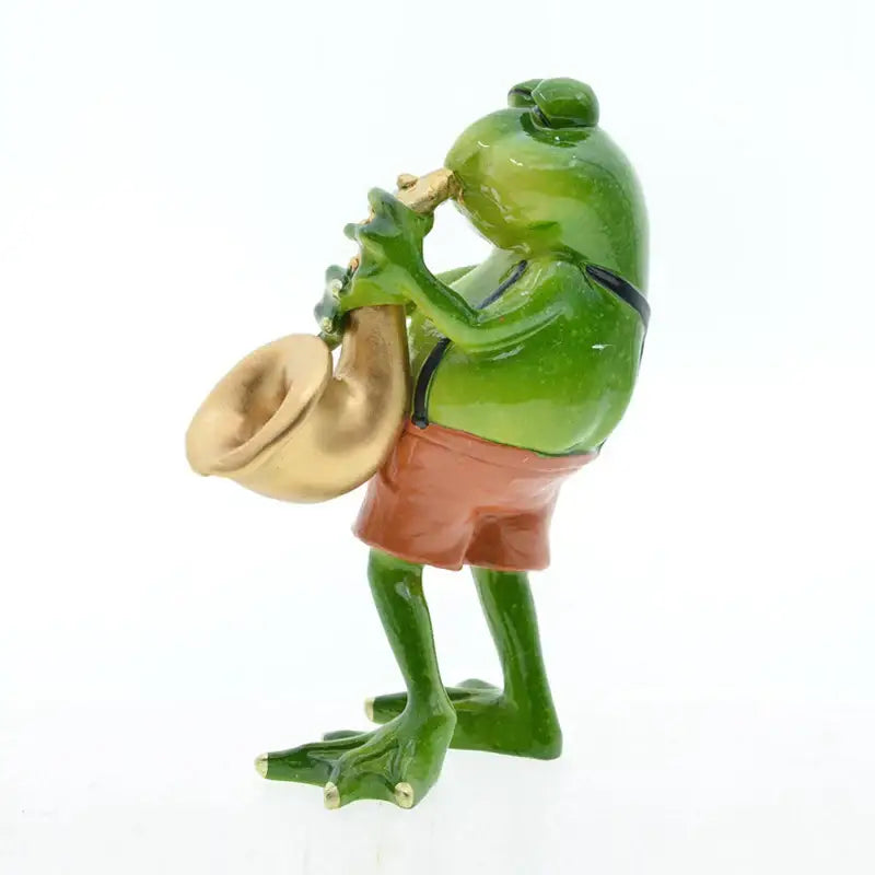 Modern green resin frog band figurine playing a golden saxophone wearing orange shorts for living room decorbites frog band decor