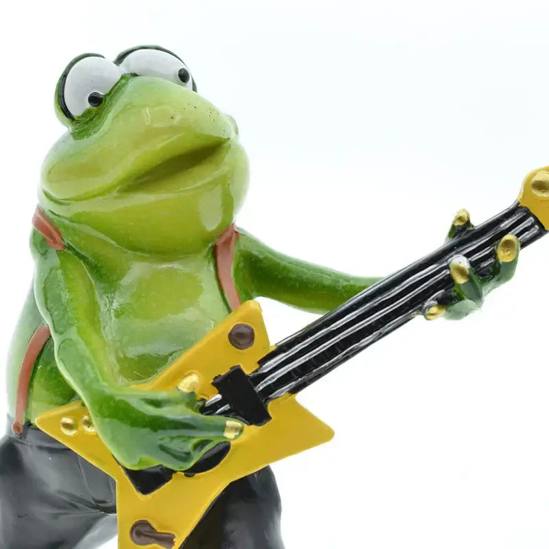 Modern green resin frog band figurine playing a yellow star-shaped electric guitar for living room decorbites frog band decor