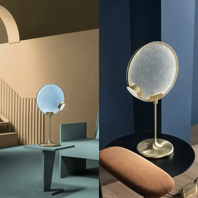 A sleek circular vanity mirror with textured frosted glass and polished brass stand coordinating with decorbites brass pendant light