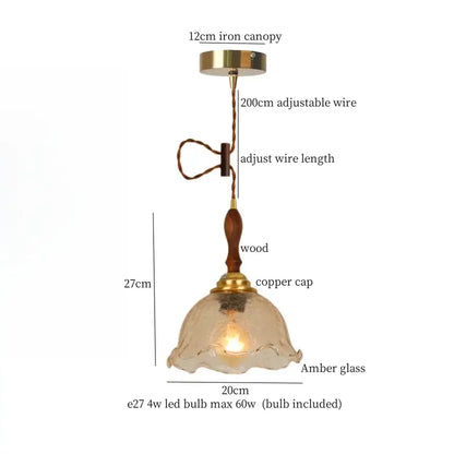 Modern green wave glass pendant light with warm amber glass, wooden stem, brass accents, and adjustable suspension by decorbites green wave