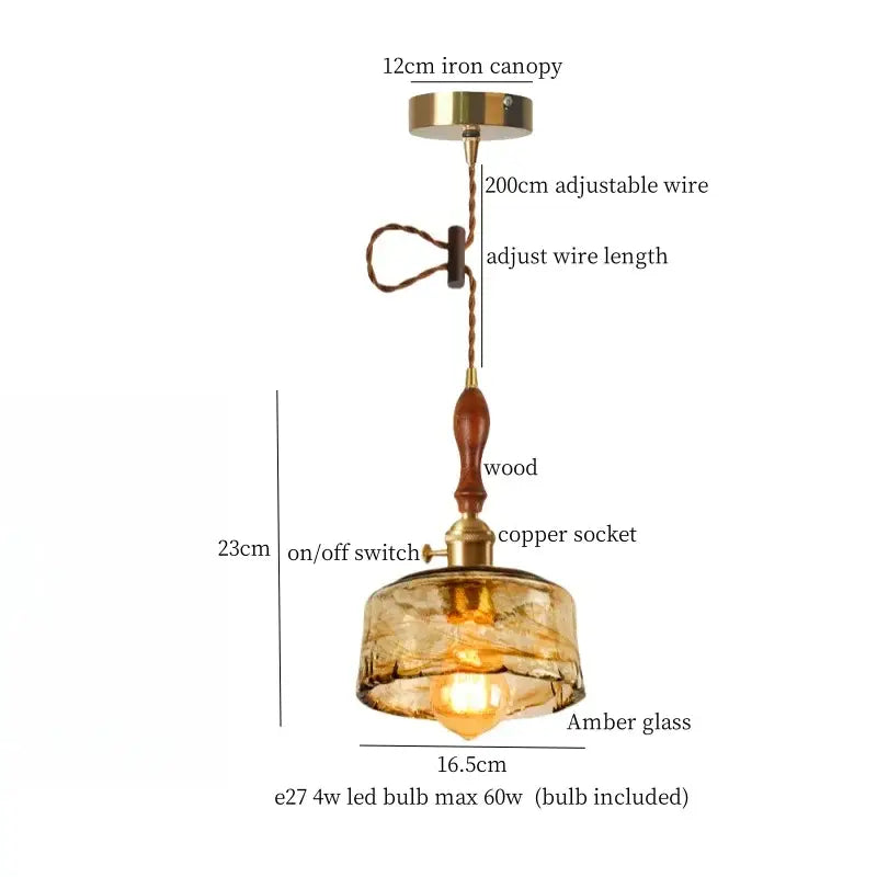 Modern green wave glass pendant light with warm amber glass, wooden handle, brass accents, and adjustable wire suspension
