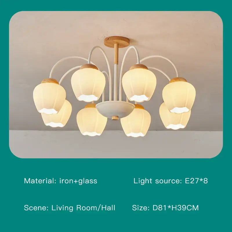 A modern green white chandelier with eight warm glass globes and a wooden hub for living room lighting