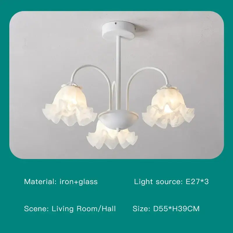 White chandelier ceiling light with three arms and delicate ruffled glass shades in modern green white design