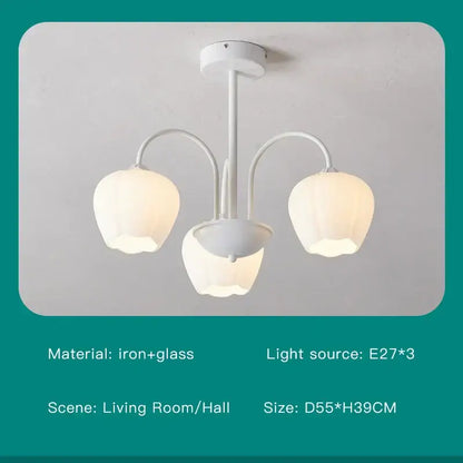 Modern green white chandelier featuring a white iron and glass chandelier with three tulip-shaped lampshades for ceilings