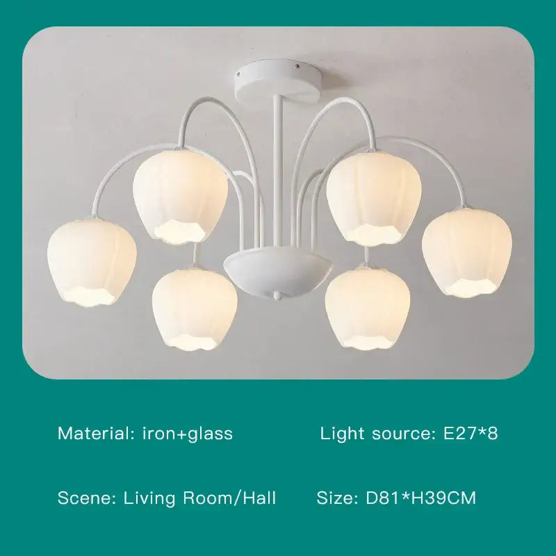Modern green white chandelier featuring a white iron and glass design with five pear-shaped frosted glass shades for living room use