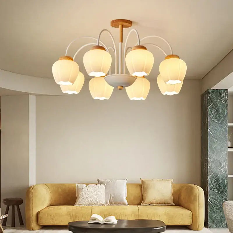 Modern green white chandelier featuring six warm-toned frosted glass lampshades and light wood frame ceiling light