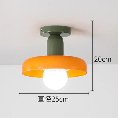 Modern pendant lights with matte olive green base and orange bowl-shaped shade from decorbites colorful glass collection