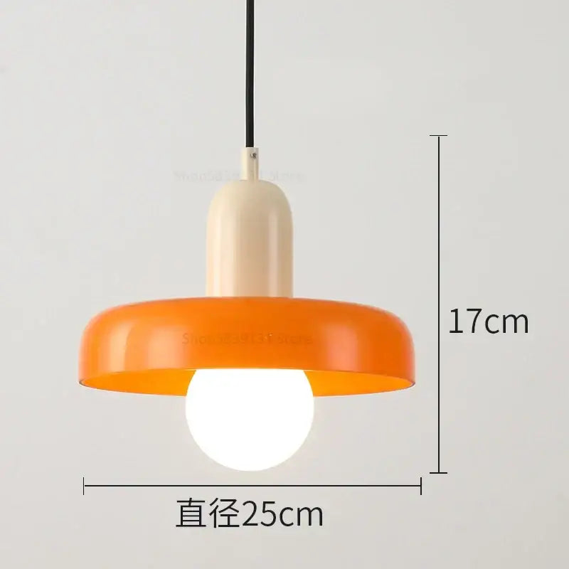 A modern pendant light with a vibrant orange glossy shade and cream stem from decorbites colorful glass pendant lights collection