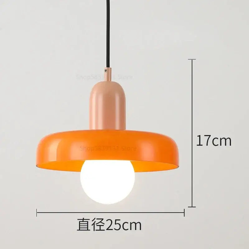 Modern pendant light with vibrant orange glossy dome and matte peach stem from decorbites colorful glass pendant collection