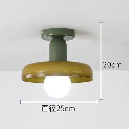 Modern green and white colorful glass pendant lights featuring an olive green and mustard yellow matte finish from decorbites colorful glass pendant collection