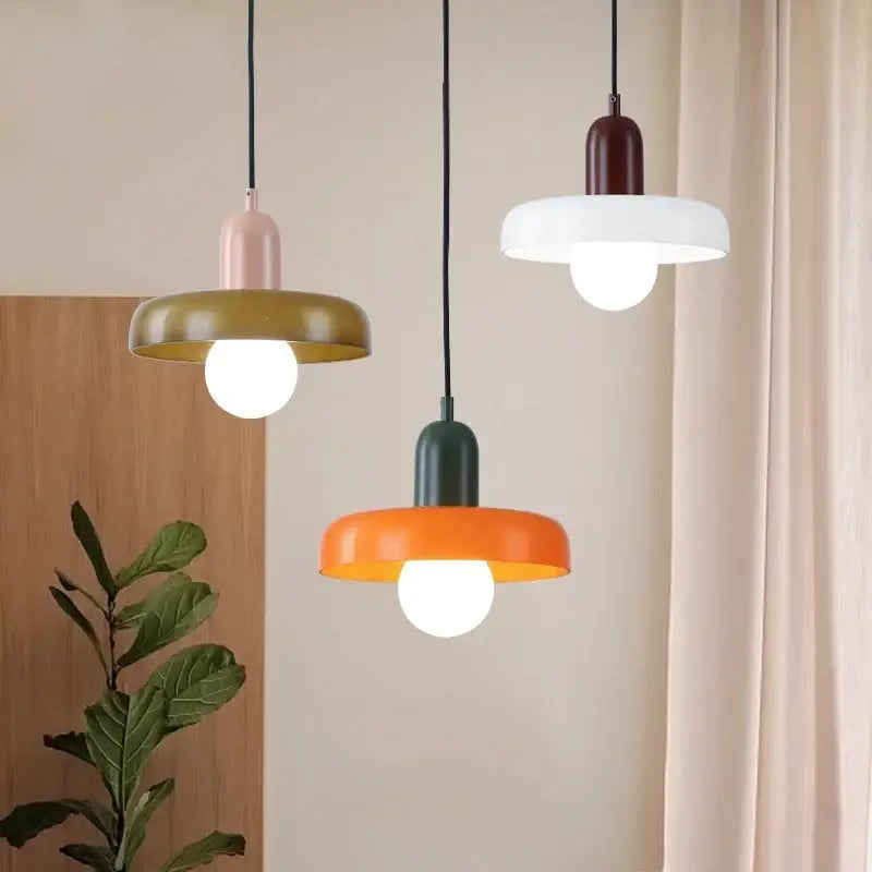 Three modern pendant lights with colorful matte metal shades in pink olive green and orange for dining room decorbites colorful glass pendant