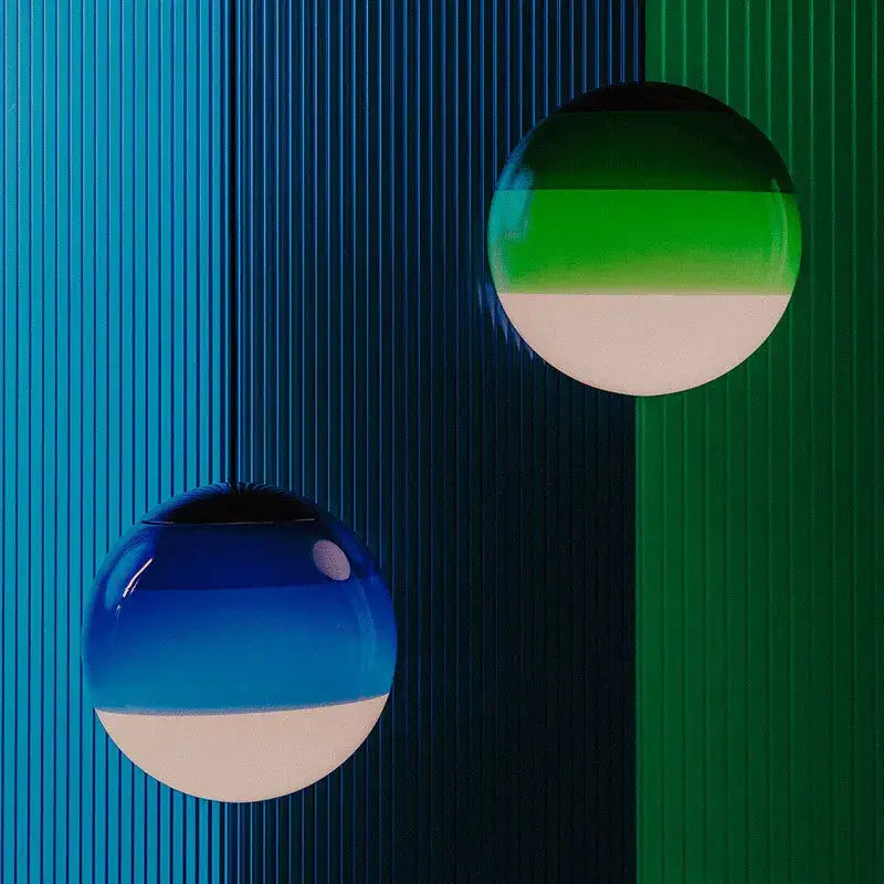 Two spherical decorbites glass ball led pendant lights with blue-to-white and green-to-white shades for dining room lighting