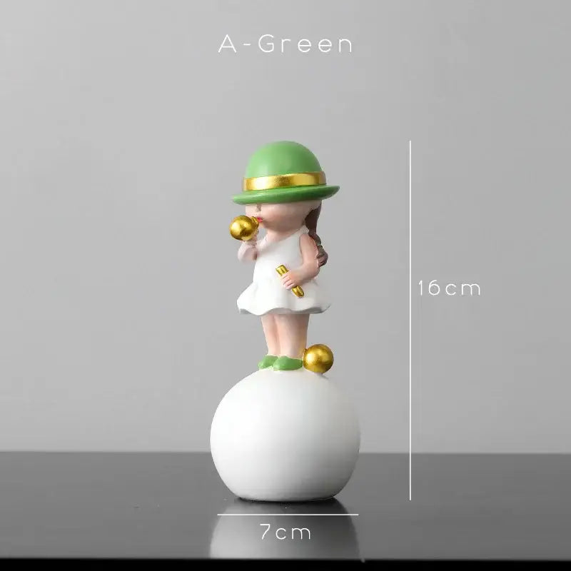 A charming green-hatted figurine in a white dress blowing bubble gum atop a white sphere with gold accents for living room decor