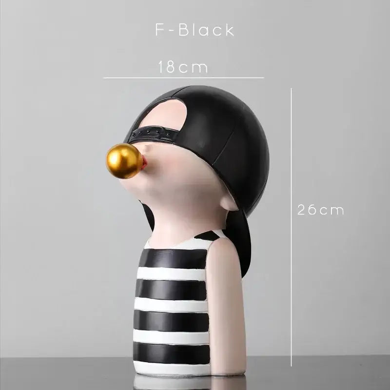 Modern green and white polka dot bubble gum blowing statue featuring black and white striped figurine with gold bubble