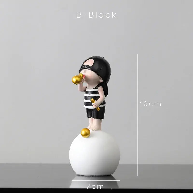 Modern green and white polka dot bubble gum blowing statue with black and white striped figurine holding golden objects