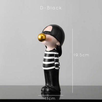 Modern green and white polka dot bubble gum blowing statue featuring a black and white striped figurine with glossy gold bubble