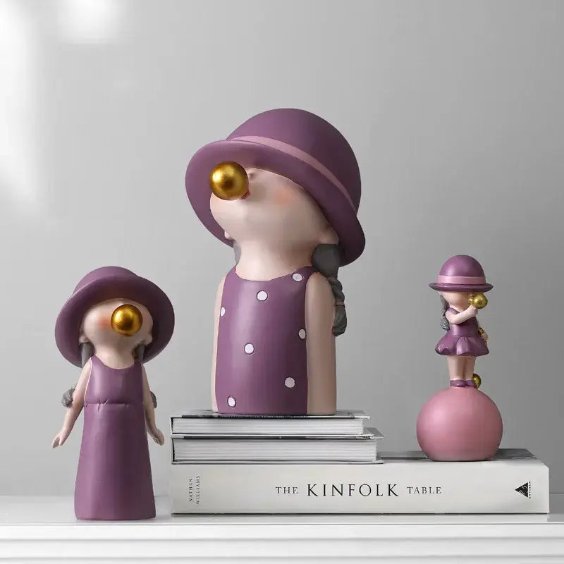 Modern green and white polka dot bubble gum blowing statue featuring purple resin girls in hats with golden bubbles for living room decor