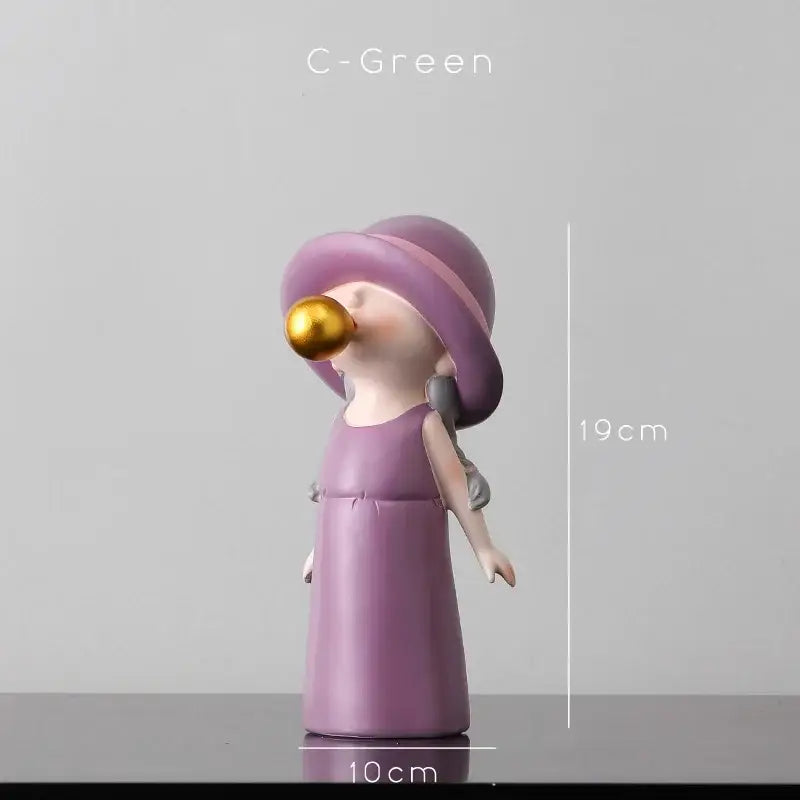 Modern green and white polka dot resin statue of a purple girl in a hat blowing a golden bubble gum bubble for living room