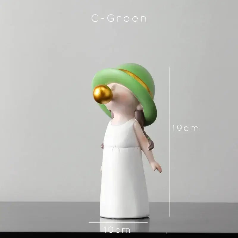 A modern green and white polka dot bubble gum blowing statue featuring a glossy figurine in a green hat and white dress