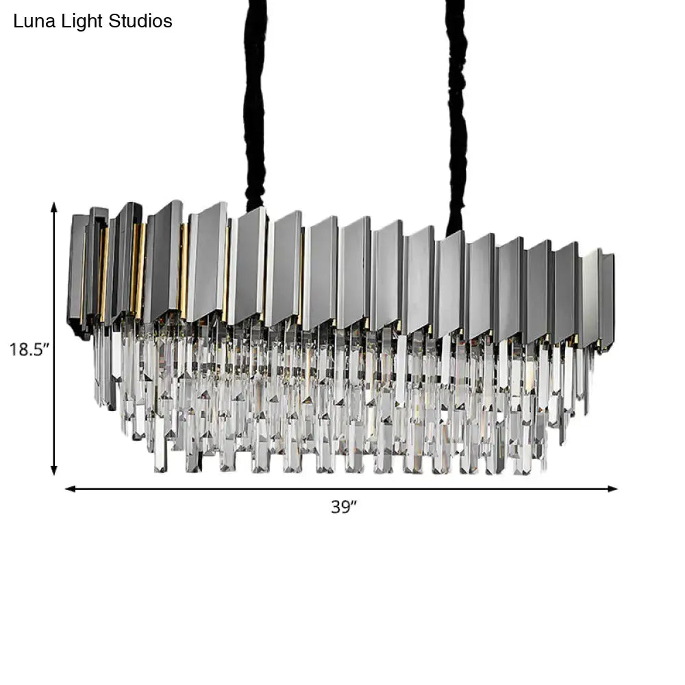 Modern grey crystal pendant chandelier with sleek metallic frame and cascading clear prisms for kitchen island