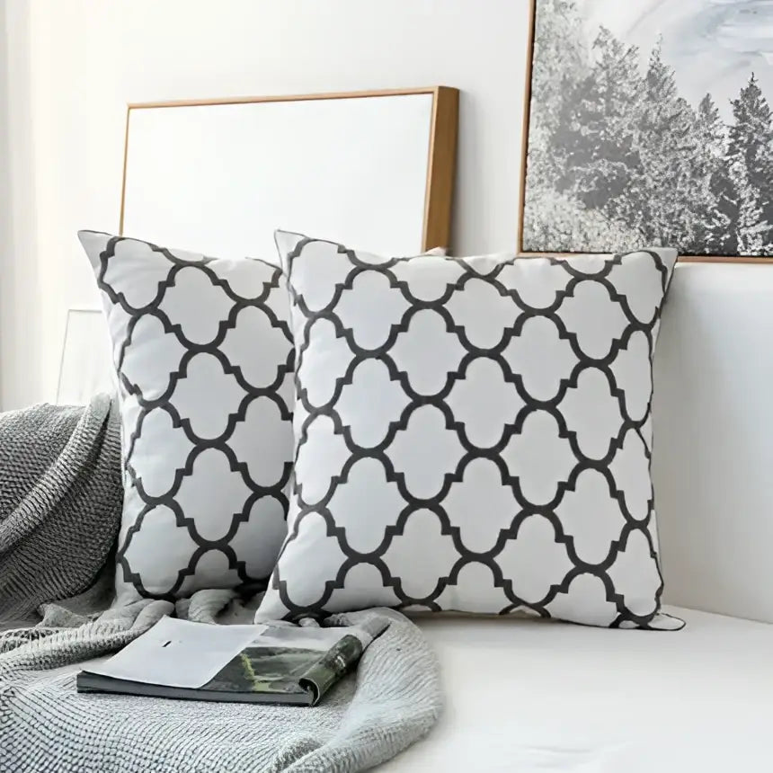 White throw pillows with black geometric quatrefoil patterns modern grey geometric embroidered cushion cover decorbites
