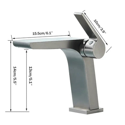 Modern gun grey basin faucet featuring a brushed stainless steel waterfall spout and integrated handle for bathroom use
