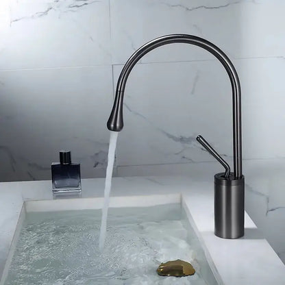 Modern gun grey brass basin faucet with a sleek matte black curved spout and cylindrical base for kitchen use by decorbites
