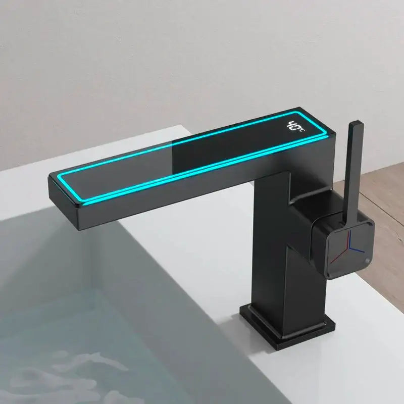 Modern gun grey basin faucet with sleek rectangular spout and digital display showing bathroom temperature sensor by decorbites gun grey