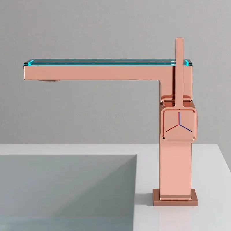 Modern gun grey basin faucet with sleek rose gold angular design and illuminated turquoise glass spout by decorbites gun grey