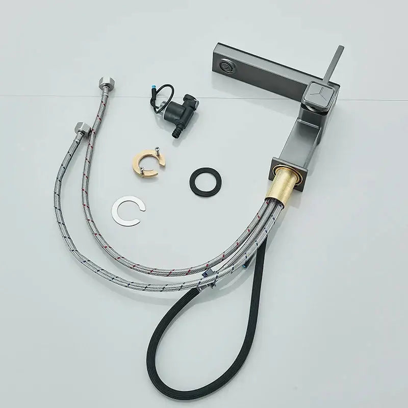 Modern gun grey basin faucet with matte black and brushed brass accent and braided chrome hoses decorbites gun grey