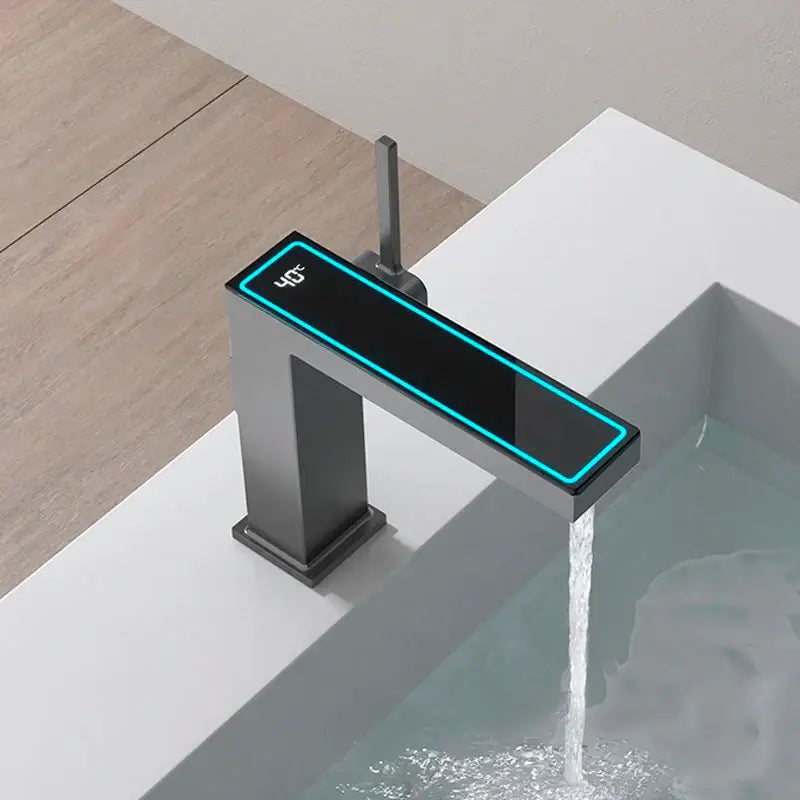 Modern gun grey basin faucet with sleek rectangular design and glowing blue led temperature display decorbites gun grey