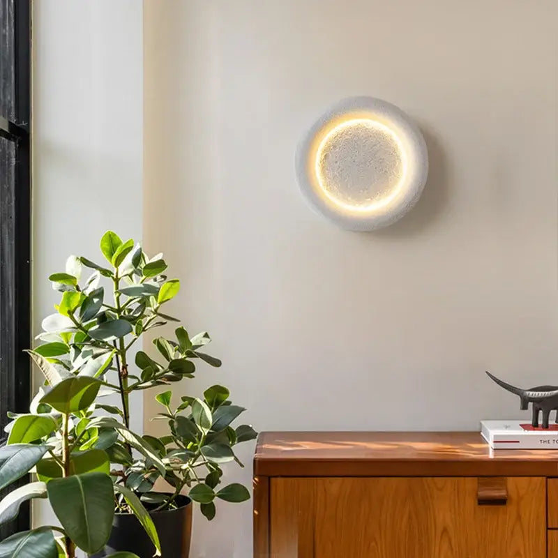 Modern gypsum white led full moon wall lamp with textured concrete surface and warm yellow inner ring for bedroom decorbites wall lamp