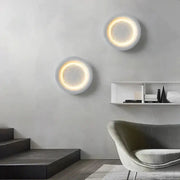 Two circular wall lamps with gypsum white led full moon design and warm glowing rings for modern bedroom decorbites decor