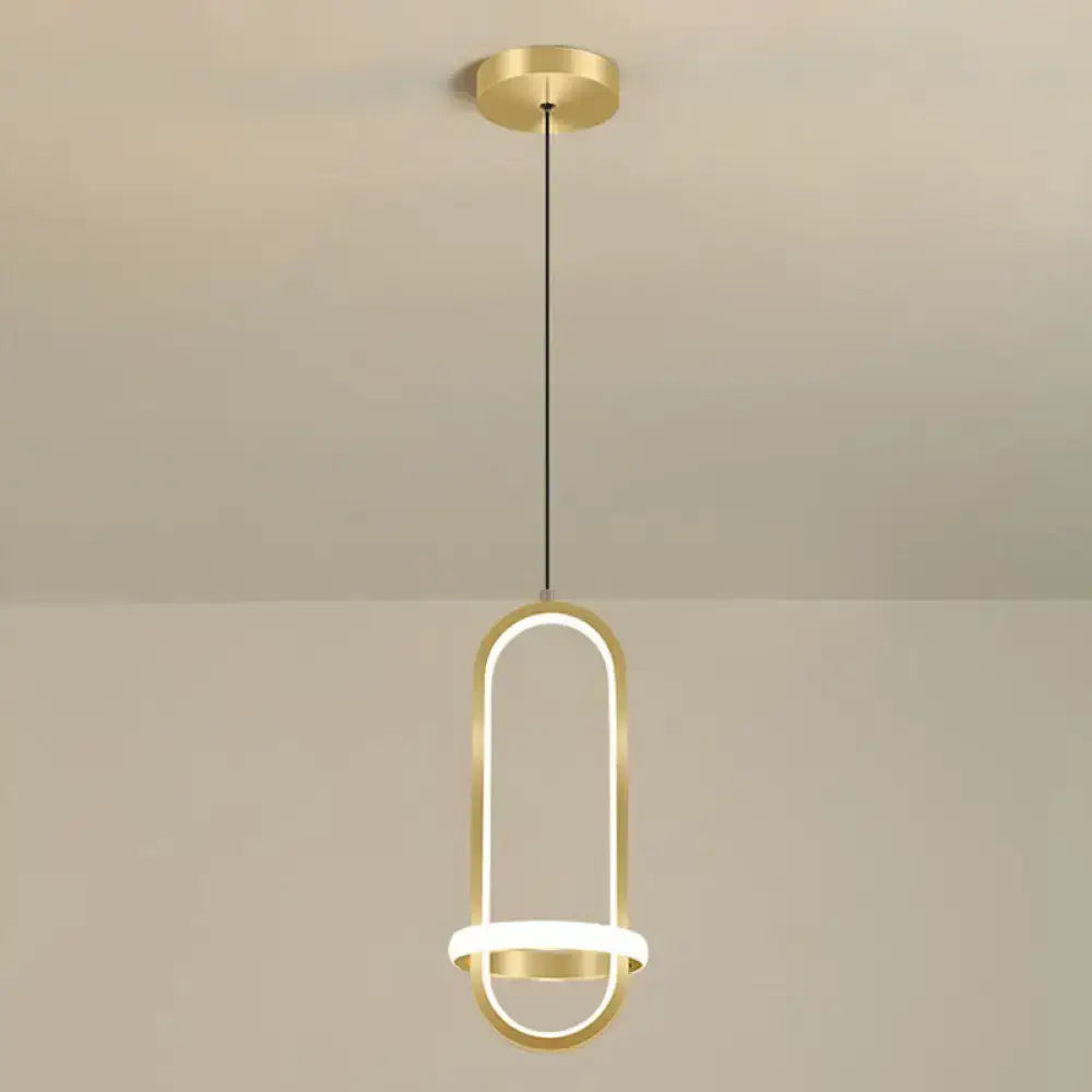 Gold-finished modern halo ring bedside pendant light with sleek elongated oval frame and integrated led lighting