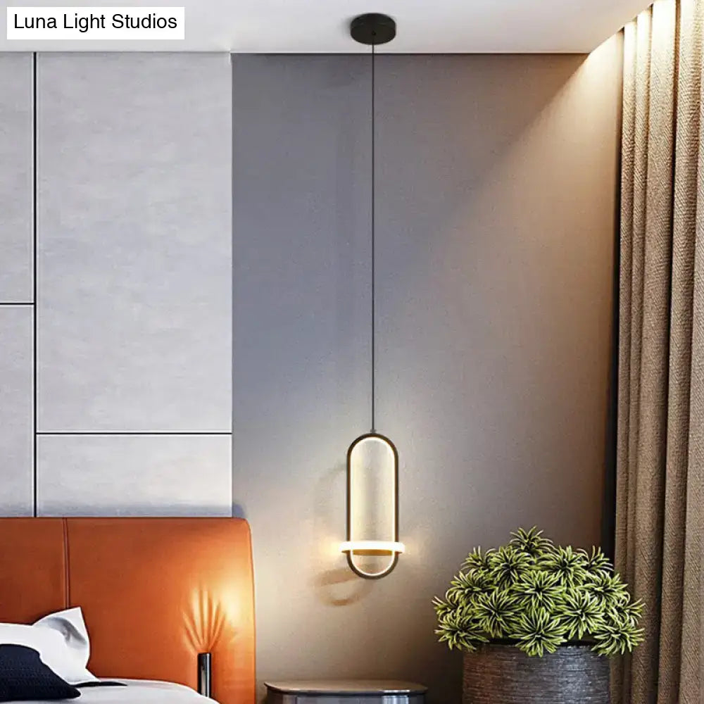Modern halo ring bedside pendant light featuring a sleek oval shape with warm ambient glow for bedroom use