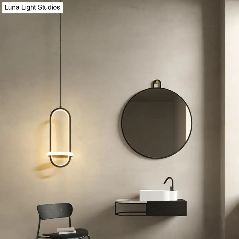Modern halo ring bedside pendant light with sleek elongated oval design and warm led illumination for bedroom use