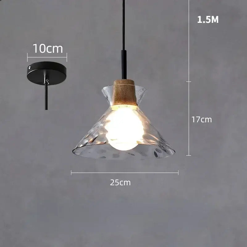 Modern hammered clear glass pendant lamp featuring textured decorbites clear glass with cork accent and black metal hardware
