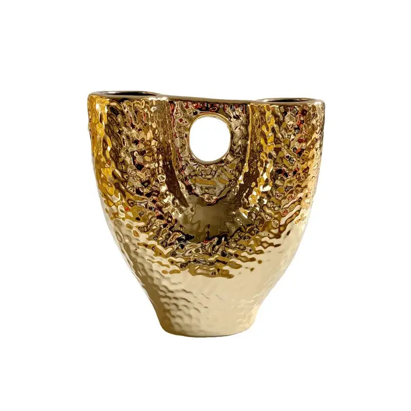 Modern hammered gold vase by decorbites with textured ceramic surface and two circular openings for living room decor