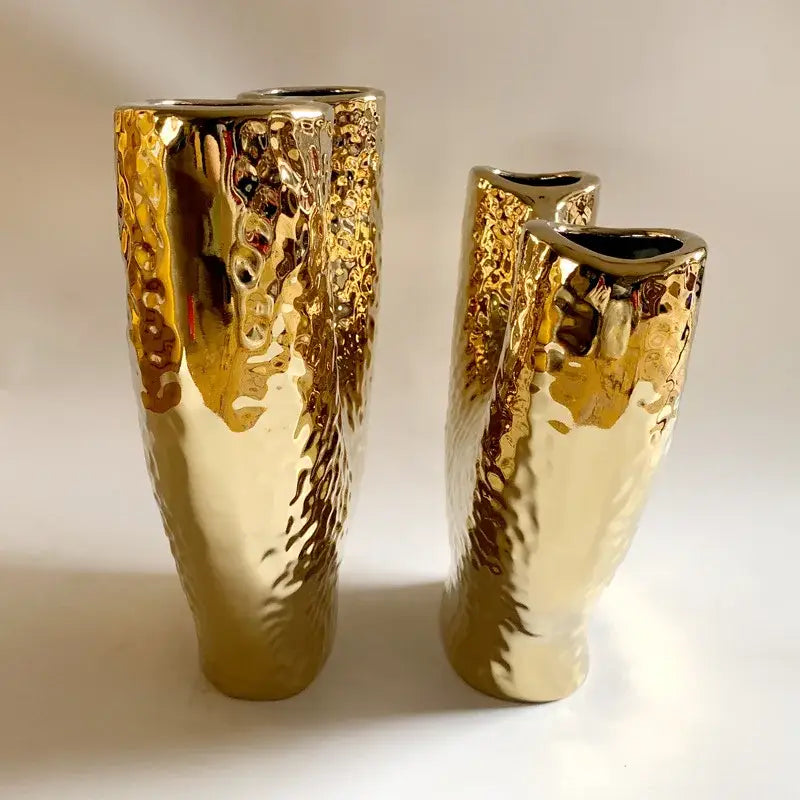 Two gold-toned ceramic vases with hammered texture and irregular openings for modern decorbites gold vase decor