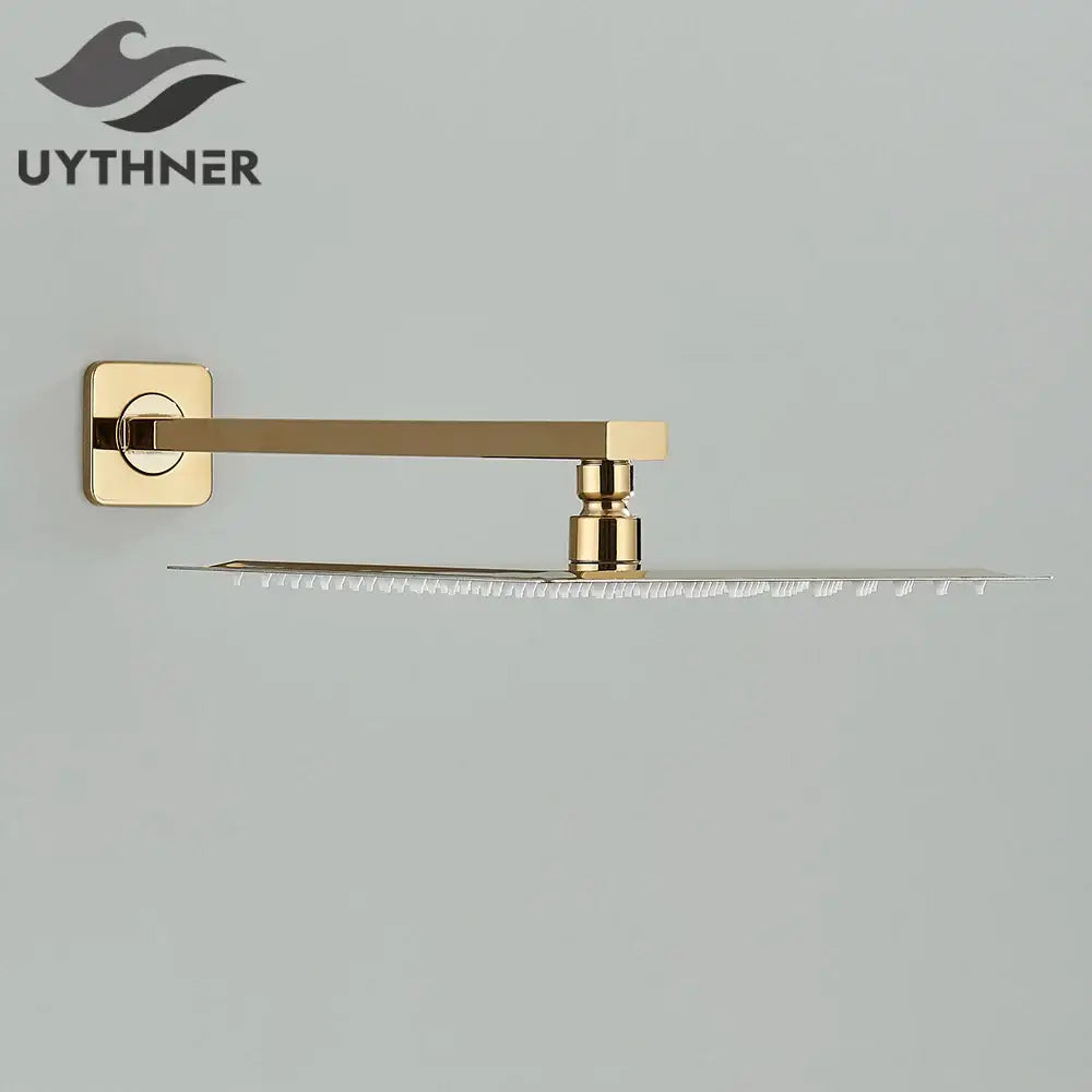 Gold-finished modern hammered square wall mounted shower head with sleek design and multiple water jets for bathroom use