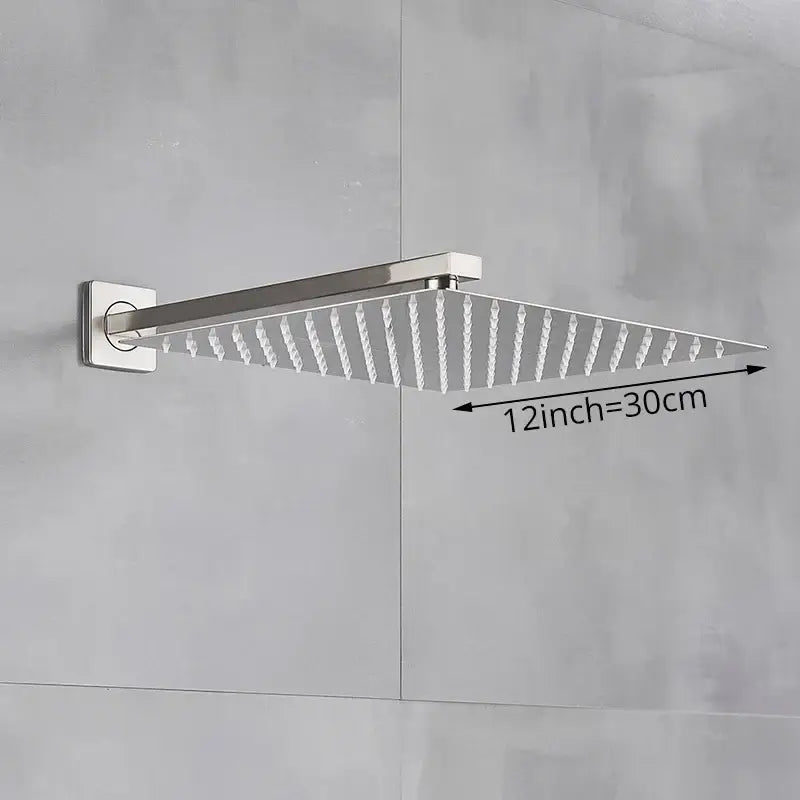 Modern hammered square wall mounted 12-inch polished chrome shower head with textured spray nozzles for bathroom use
